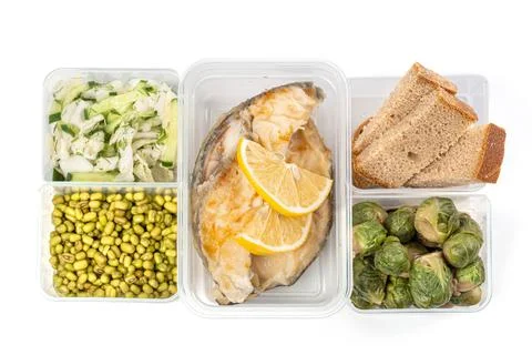 Lunch boxes with fish, vegetables, mung and black bread, top view Stock Photos