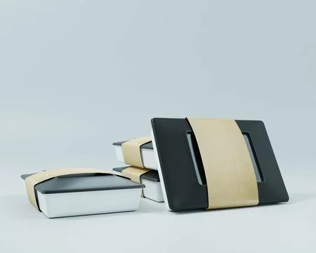 Lunch boxes, glasses, plastic spoons and forks placed on a white background. Stock Photos