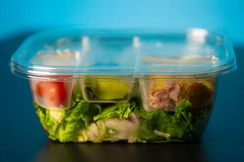 Lunch chicken salad for work in plastic containers. Healthy food Stock Photos