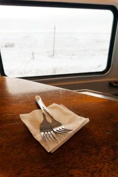 Lunch items in the dining train. spoon and fork in the cafe of the railway train Stock Photos