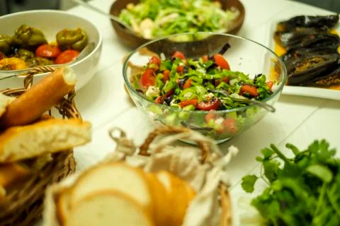 Lunch set on the table fresh products, bread, greens, dolma Stock Photos