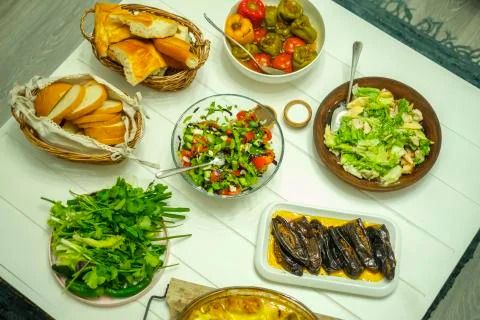 Lunch set on the table fresh products, bread, greens, dolma Stock Photos