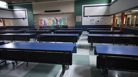 Lunch Setup in Junior High Cafeteria With Tables Arranged for Midday Meal Stock Footage 309682520