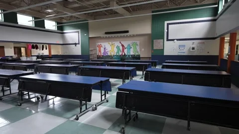 Lunch Setup in Junior High Cafeteria With Tables Arranged for Midday Meal Stock Footage 310045943