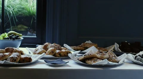 Lunch snacks on white table beside window Stock Footage 64263127