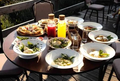 Lunch on the summer terrace, table setting. Stock Photos