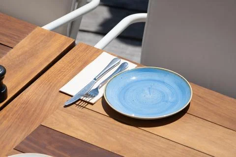 Before lunch time, empty stylish beach cafe with served tables waiting for .. Stock Photos