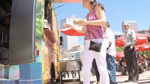 Lunch time gathering of gourmet food trucks at the Civic Center Park. Stock Footage