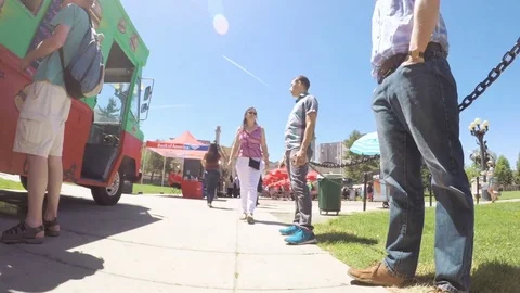 Lunch time gathering of gourmet food trucks at the Civic Center Park. Stock Footage