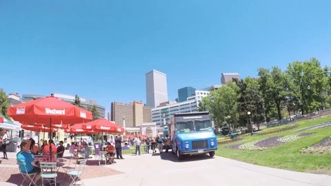 Lunch time gathering of gourmet food trucks at the Civic Center Park. Stock Footage