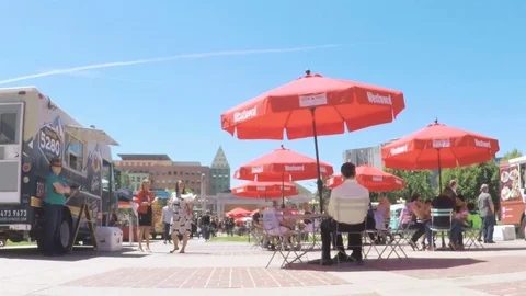Lunch time gathering of gourmet food trucks at the Civic Center Park. Stock Footage