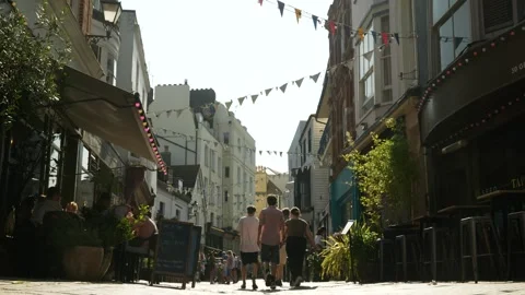 Lunch time meal in Old Town Hastings on summer day 6K Stock Footage 330052333