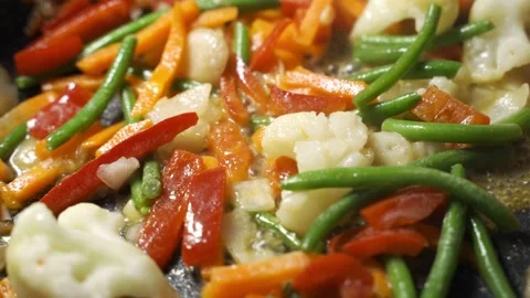 Lunch of vegetables. Cook the vegetable stew in a pan. Frozen vegetables on a Video stock 150773688
