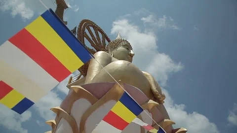 Lunga, Buddhist prayer flags, huge statue of a Buddha Stock Footage 77983966