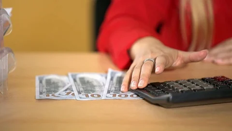 Luscious blonde in a red jacket performs office work, an office girl with big Stock Footage 100371850