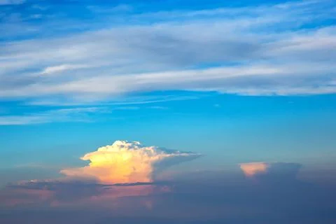 Lush colored clouds in the sky before sunset Stock Photos
