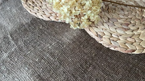 Lush dried hydrangea flower on damp linen burlap and water hyacinth placema.. Stock Footage 320500960