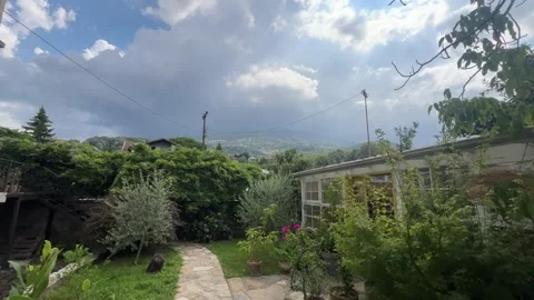 Lush Garden with Mountain View under Dramatic Clouds in Sapanca Turkey Stock Footage 342278331