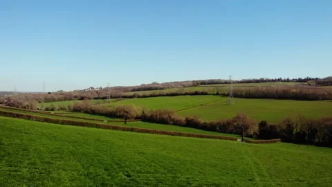Lush green fields in British countryside drone aerial Stock Footage 320562829