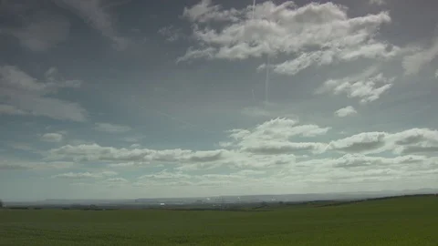 Lush Green Fields Looking Out Towards Distant Industry. Vídeos de archivo 107378365
