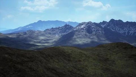 Lush green hills in front of dramatic mountain range under a bright sky Stock Illustration