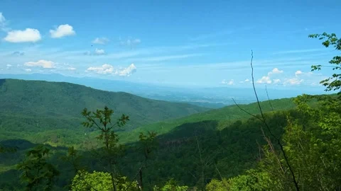 Lush green hills roll into distant blue sky. Jastrebac Mountain, Serbia. Vídeos de archivo 336023855