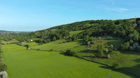 Lush Green Land surrounded by Train Lines and a Busy Motorway Stock Footage 243530167