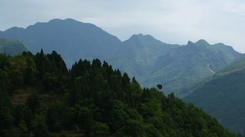 Lush green mountain range on a sunny day Stock Footage 88676482