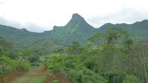 Lush Green Mountain Range With Town Stock Footage 79734696