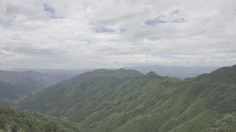 Lush Green Mountain Ranges Under Cloudy Sky Stock-Footage 343555084