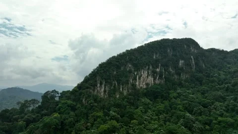 Lush Green Mountains Against Cloudy Sky in Remote Nature Landscape Stock Footage 311575285