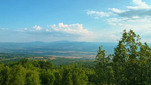 Lush green trees frame a sweeping valley view. Pirot City, Serbia Vídeo Stock 341962722