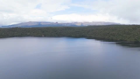 Lush lagoon reflections under cloudy sky Stock Footage 330759838
