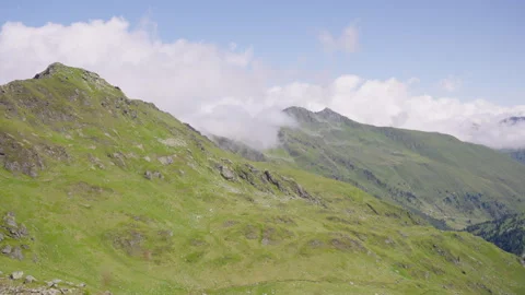Lush Mountain Range Surrounded By Clouds, Extreme Wide Shot Stock Footage 307706510
