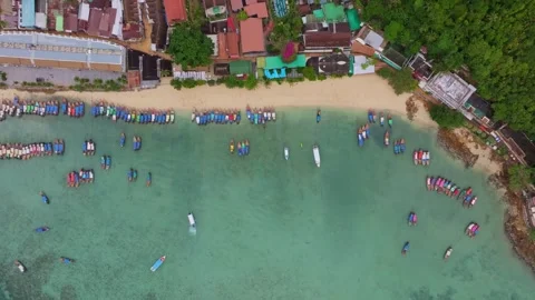 Lush Phi Phi Island framed by blue sea and boats, Thailand Stock Footage 307439857