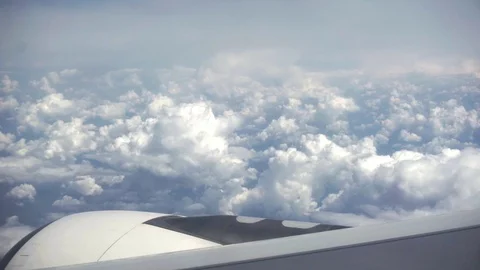 Lush white clouds, high in the sky, very beautiful view from the plane window Stock Footage 110255705