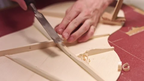 Luthier builds acoustic guitar interior Stock Footage 113887053