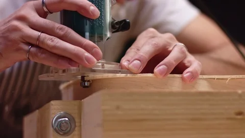 Luthier carving a guitar shape Видео 117983874