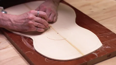 Luthier carving  rounded guitar rosette Stock Footage 112003478