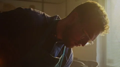 Luthier craftsman at work creating a unique bass instrument in workshop Stock Footage 319921713