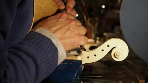 Luthier Detailing Violin Scroll in Workshop in Cremona with Italian Design and Stock Footage 304641857