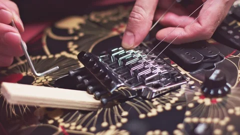 Luthier fix strings bridge on broken guitar Video stock 117986842