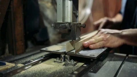Luthier forms a billiard cue running on a band saw. Stock Footage 75950477