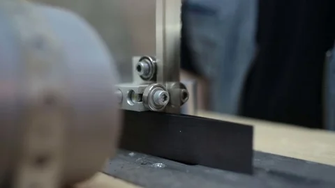 Luthier forms a billiard cue running on a band saw. Stock Footage 76444029