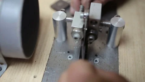 Luthier forms a billiard cue running on a band saw. Stock Footage 76444533