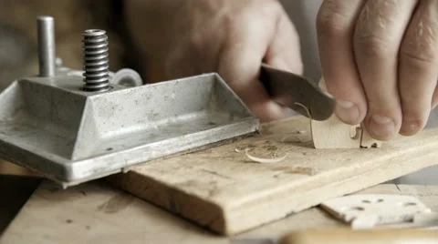 Luthier making bridge for violin Stock Footage 65453016