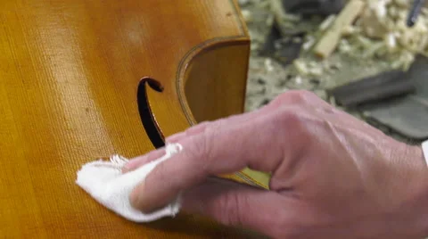 A luthier the polished surface of a baroque instrument Stock Footage 61914505
