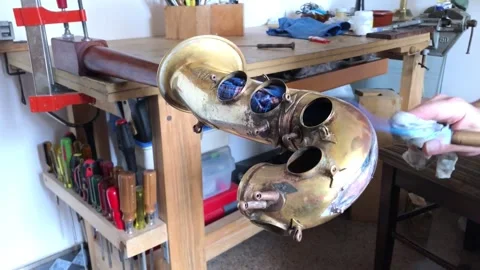 Luthier repairs saxophone in his workshop Stock Footage 170672650