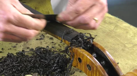 A luthier replaces the touch of a cello Stock Footage 61914629