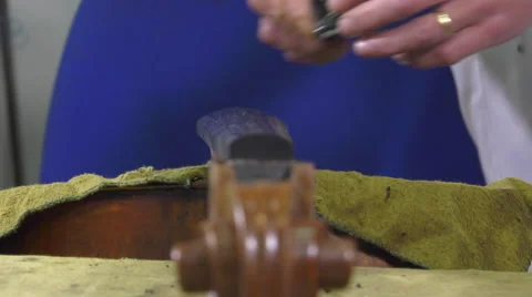 A luthier replaces the touch of a cello Stock Footage 61914680